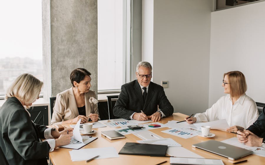 Business professionals reviewing documents